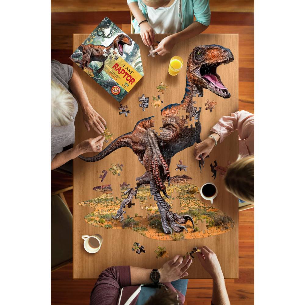 Four people assembling a uniquely shaped dinosaur jigsaw puzzle with large pieces on a wooden table, surrounded by coffee and juice, ideal for children's puzzles and games collections.