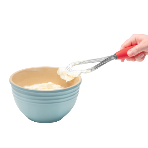 Hand holding a multi-functional red-handled whisk lifting whipped cream from a blue ceramic bowl, ideal for Kitchen & Food, Kitchen Gadgets, Cooking and Baking Helpers, Best Sellers, Promo Eligible collections.