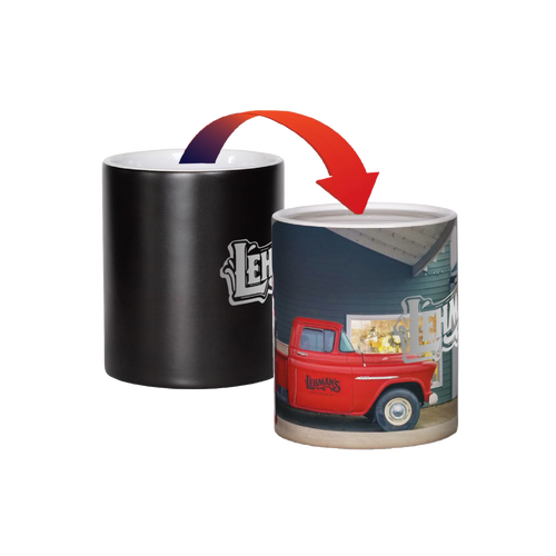 Ceramic coffee mug that reveals a vibrant image of Lehman's storefront and red vintage truck when filled with hot liquid, ideal for Kitchen & Food and USA Made collections.