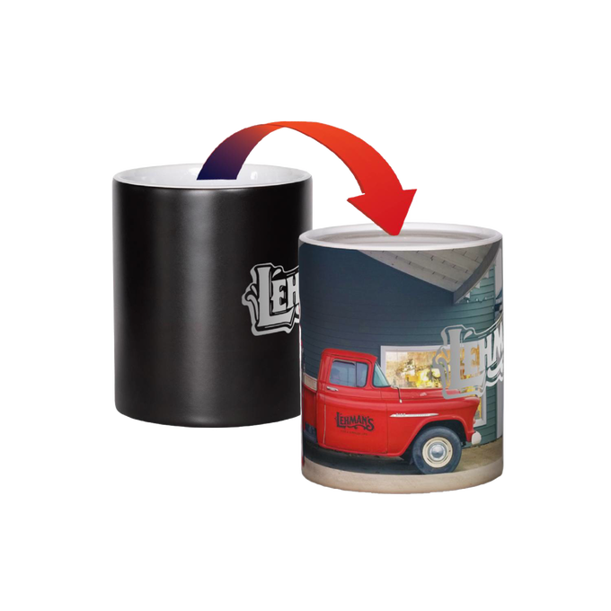 Ceramic coffee mug that reveals a vibrant image of Lehman's storefront and red vintage truck when filled with hot liquid, ideal for Kitchen & Food and USA Made collections.