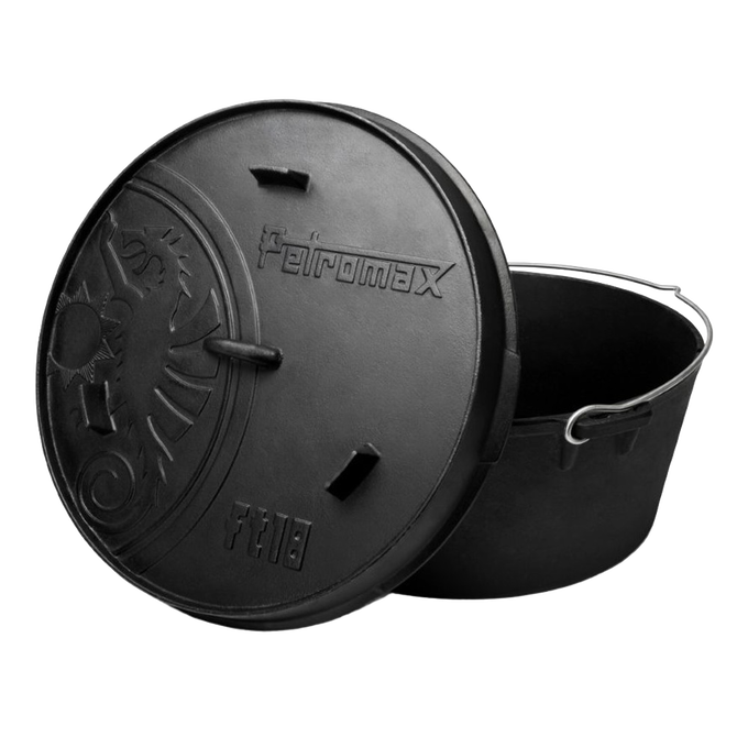Seasoned cast iron Dutch oven with flat base, featuring a lid embossed with a unique sunburst pattern and the Petromax logo, perfect for Kitchen & Food, Cookware, Cast Iron collections.