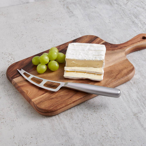 Stainless steel soft cheese knife with vented blade and forked tip resting on a wooden cutting board beside sliced brie and green grapes, ideal for Kitchen & Food and Food Prep collections.