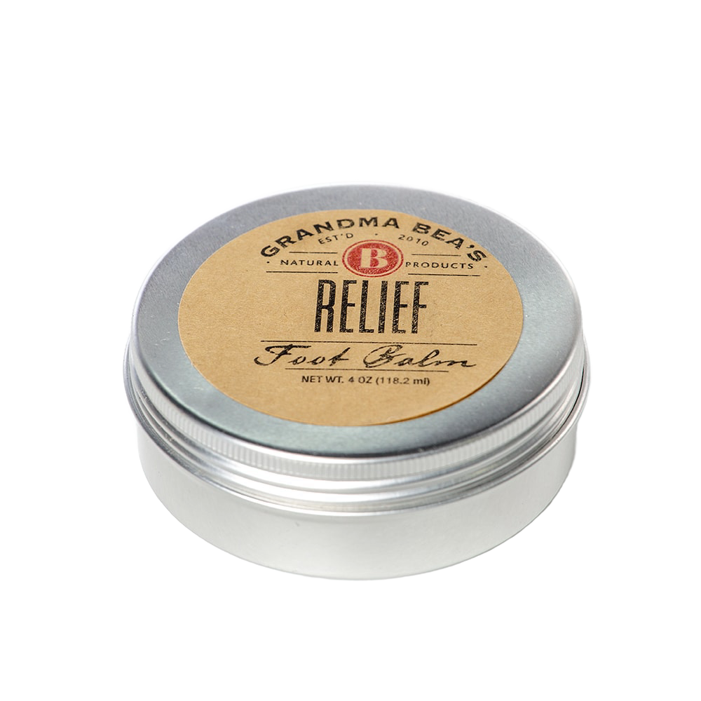 Handcrafted metal tin of soothing foot balm with a simple brown label, made in USA, featured in Health & Wellness, Balms, Creams and Lotions, and Best Sellers collections.
