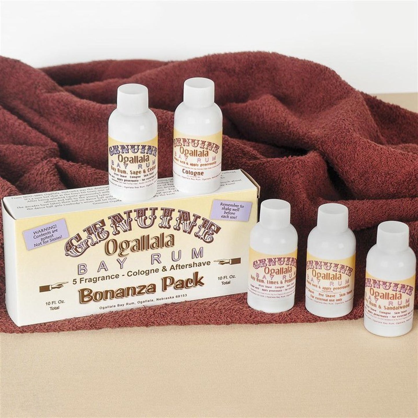 Set of handcrafted Ogallala Bay Rum Aftershave and four colognes including original, sage and cedar, sandalwood, and lime and pepper, featured in Health & Wellness and Grooming collections.