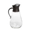 Clear glass syrup dispenser with ergonomic black plastic lid and handle, designed for drip-free pouring and easy storage, ideal for Kitchen & Food and Storage and Serving collections.