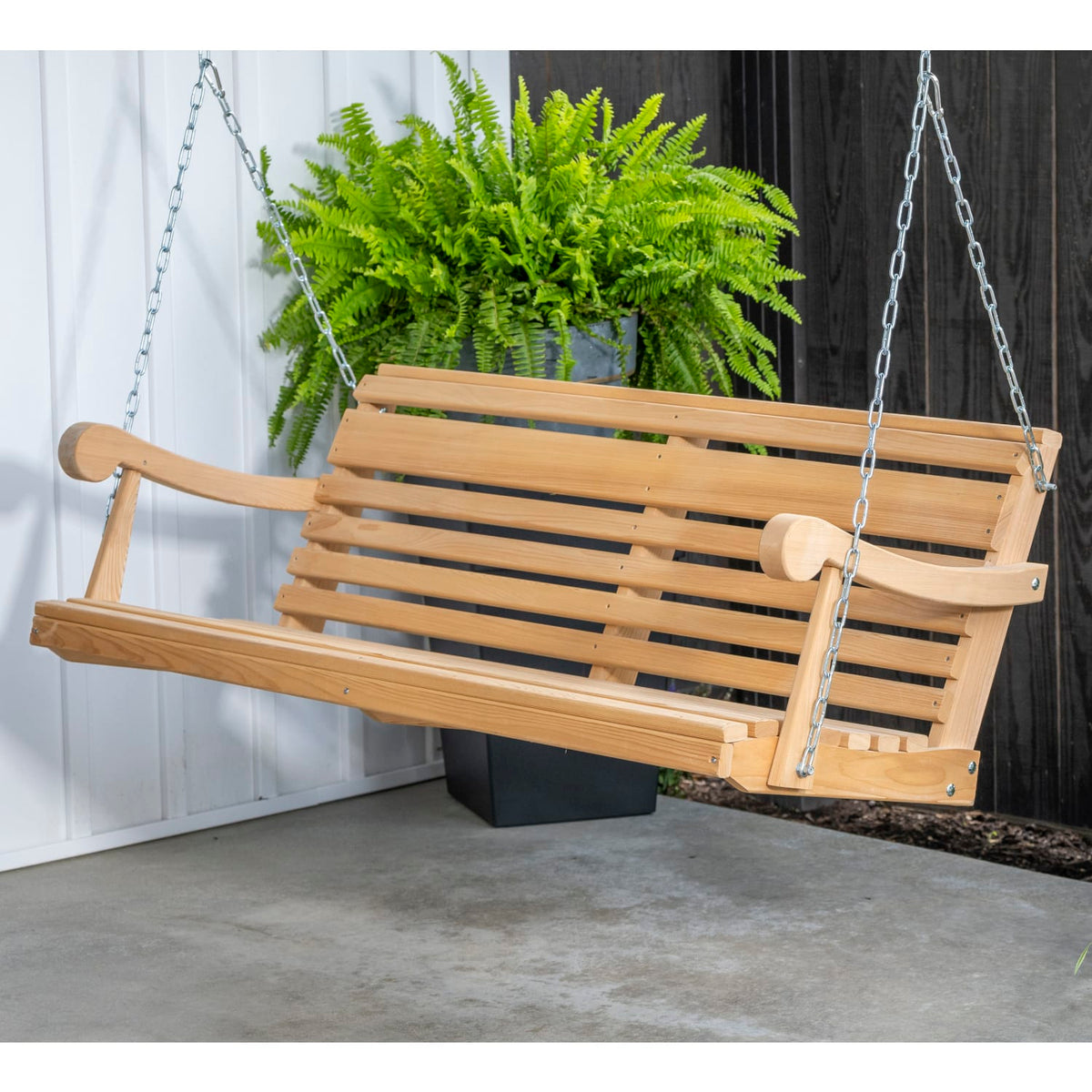 Handcrafted 5-foot cypress porch swing with slatted seat and back, suspended by chains, made in USA Amish style for outdoor furniture in Home & Decor collections.