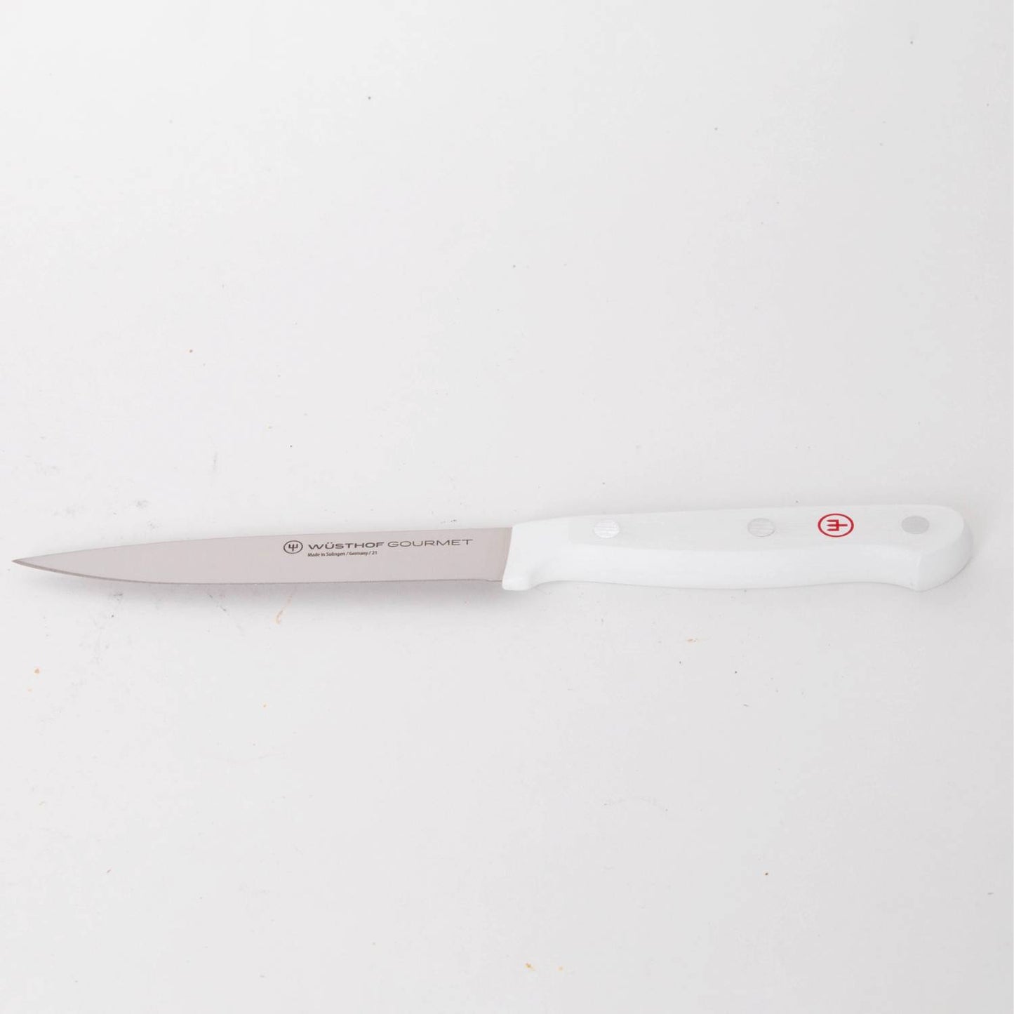 Slim stainless steel knife with a sharp pointed blade and ergonomic white handle, designed for precise trimming and food prep, ideal for Kitchen & Food, Food Prep, and Knives & Axes collections.