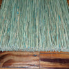 Close-up of tightly bundled natural corn straw bristles with subtle blue accents on a handcrafted Amish-made broom, resting on a wooden surface, featured in Home & Decor and Household Cleaning collections.