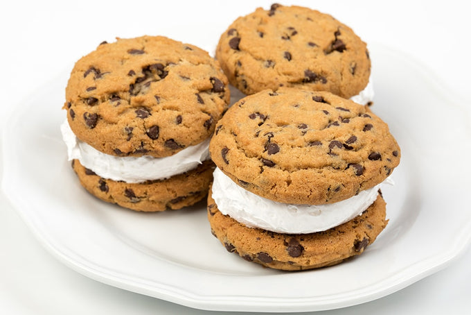Three handcrafted whoopie pies made with soft chocolate chip cookies and fluffy filling displayed on a white plate, ideal for Kitchen & Food, Snacks and Sweets, USA Made, and Best Sellers collections.