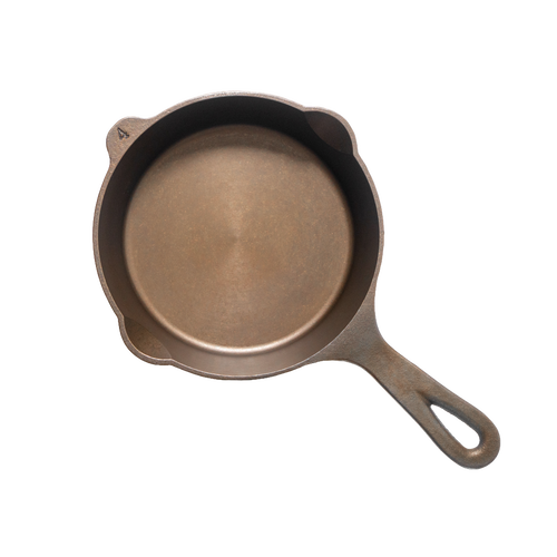 Top view of a handcrafted, lightweight cast iron skillet with smooth cooking surface and dual pour spouts, made in USA, ideal for Kitchen & Food, Camping, Cast Iron, and Farm collections.