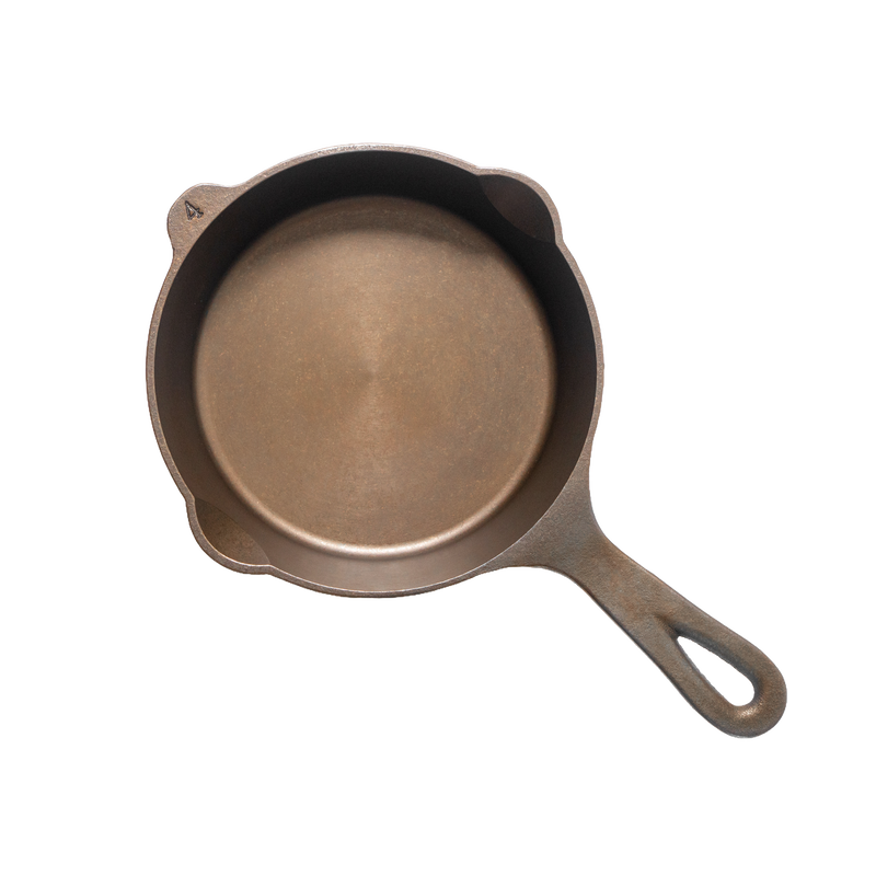 Top view of a handcrafted, lightweight cast iron skillet with smooth cooking surface and dual pour spouts, made in USA, ideal for Kitchen & Food, Camping, Cast Iron, and Farm collections.