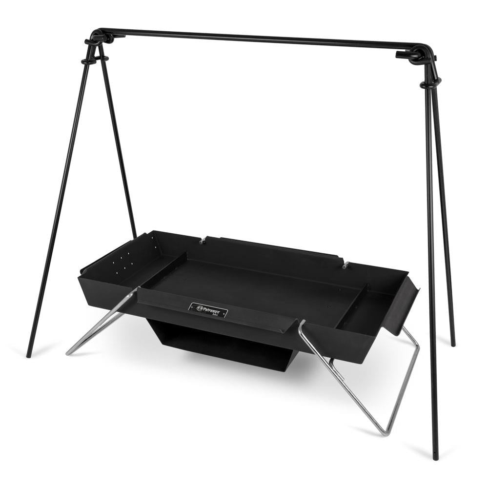 Portable black steel fire trough with foldable legs and an attached baking compartment, designed for versatile outdoor cooking, featured in Farm, Garden & Tool, Camping, and Best Sellers collections.