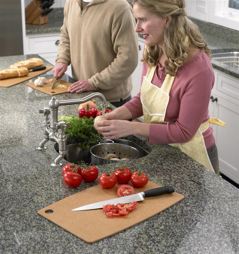 Lightweight, maintenance-free Epicurean board with utility hole, featuring sliced tomatoes and knife on countertop, ideal for Kitchen & Food, Food Prep, Knives, Sharpeners and Cutting Boards collections.