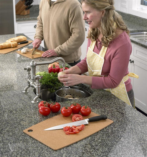 Lightweight, maintenance-free Epicurean board with utility hole, featuring sliced tomatoes and knife on countertop, ideal for Kitchen & Food, Food Prep, Knives, Sharpeners and Cutting Boards collections.