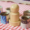 Handcrafted wooden pot maker tool used to form newspaper seedling pots, surrounded by recycled newspaper pots filled with soil, ideal for Farm, Garden & Tool, Garden Accessories, Seeds and Planting, Best Sellers, and Promo Eligible collections.