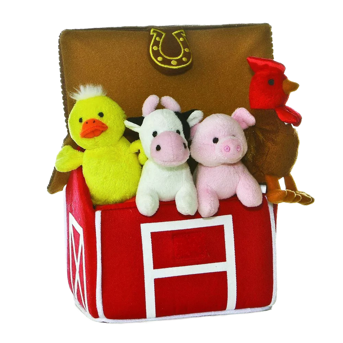 Soft plush duck, cow, pig, and rooster toys sitting inside a bright red fabric barn with a horseshoe detail, designed for indoor play and children's toy collections.