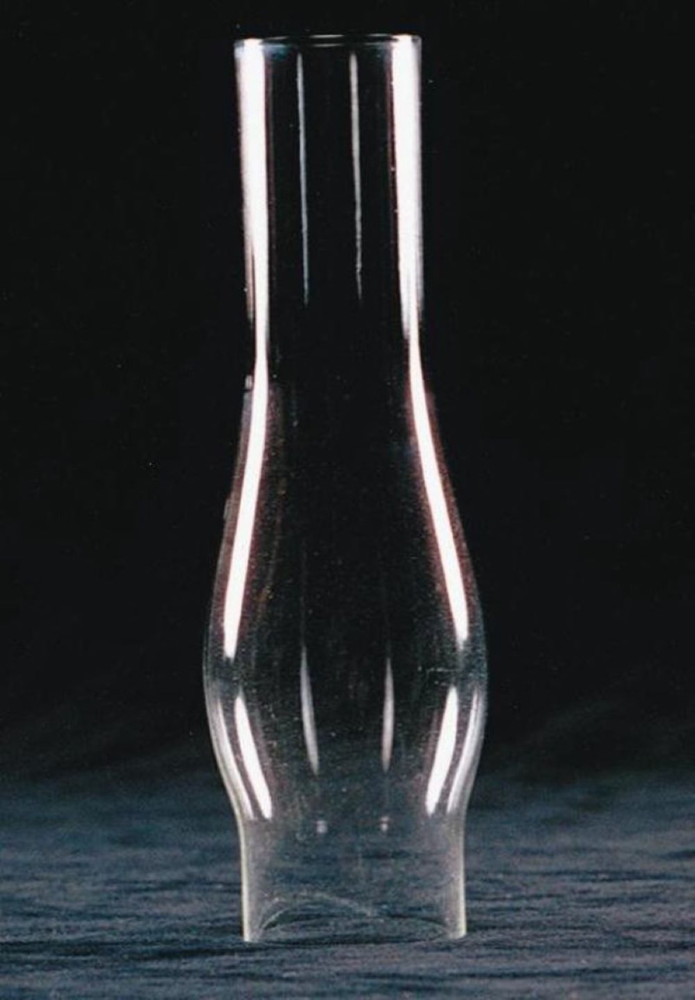 Clear glass oil lamp chimney with a gently bulging shape and narrow opening, featured in Lamps & Lighting, Parts and Accessories, Chimneys and Globes, and Best Sellers collections.