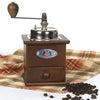 Handcrafted wooden coffee mill with metal crank handle and shiny grinding mechanism, displayed on a plaid cloth with coffee beans, ideal for Farm, Garden & Tool and Brewing Coffee and Tea collections.