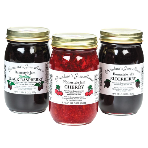 Three handcrafted jars of seedless black raspberry jam, cherry jam, and elderberry jelly with gold lids and white labels, perfect for Kitchen & Food, Pantry, Peanut Butter & Jellies, USA Made, Best Sellers, and Promo Eligible collections.