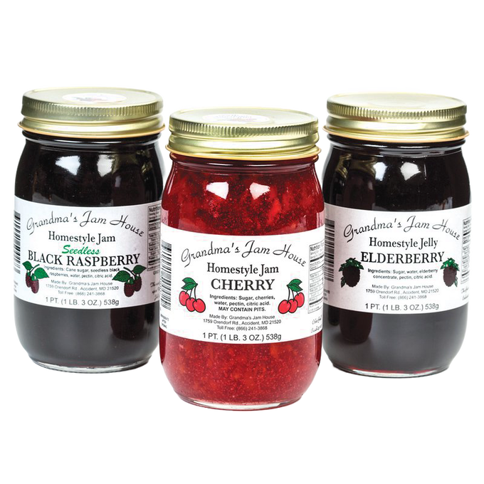 Three handcrafted jars of seedless black raspberry jam, cherry jam, and elderberry jelly with gold lids and white labels, perfect for Kitchen & Food, Pantry, Peanut Butter & Jellies, USA Made, Best Sellers, and Promo Eligible collections.