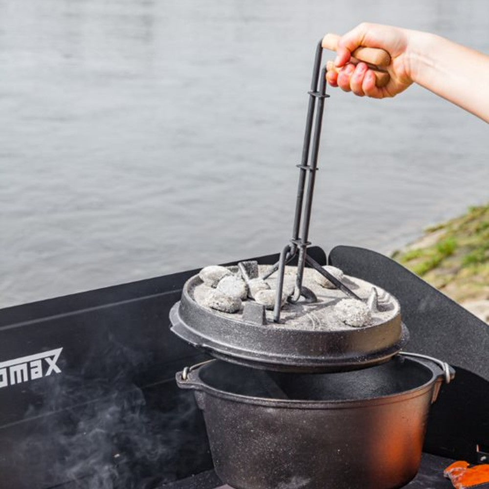 Steel tool with wooden handle designed for safely lifting hot Dutch oven lids during outdoor cooking, suitable for farm, garden & tool, camping, and best sellers collections.