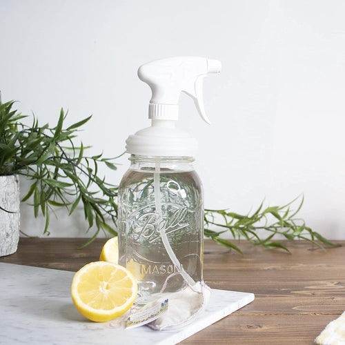 Clear glass regular-mouth Mason jar fitted with a white plastic sprayer lid and trigger, styled with fresh lemon halves and greenery, featured in Home & Decor, Household Helpers, USA Made, Best Sellers, Promo Eligible collections.