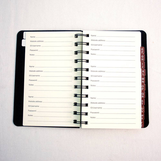 Open spiral-bound logbook featuring alphabetical tabs and lined pages for recording website addresses, usernames, passwords, and notes, designed as a handy household helper and best seller.