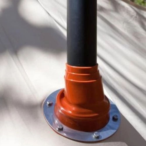 Close-up of a black pipe secured with an orange mounting flange attached to a beige tent fabric, designed for safe installation in camping and outdoor gear collections.