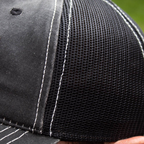 Close-up of a handcrafted adjustable hat featuring a weathered cotton front panel, black breathable mesh back, and detailed white stitching, ideal for Health & Wellness, Clothing and Accessories, Best Sellers, and Promo Eligible collections.