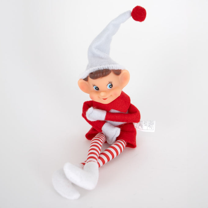Posable vintage-style pixie elf ornament with fabric body, red and white striped legs, and a tall white hat with red pom, perfect for Home & Decor and Holiday Decor collections.