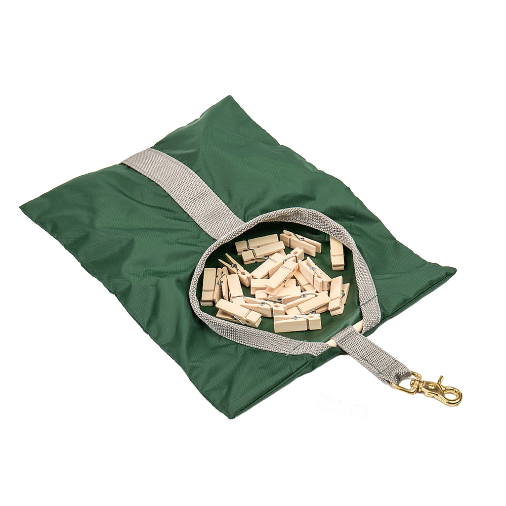 Green fabric clothespin bag with beige strap and brass clip, filled with wooden clothespins, handcrafted and Amish made, perfect for laundry and clothesline accessories.