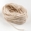 Coiled natural cotton flat-braid wick with sturdy 30-ply strands, designed for making pillar or taper candles, featured in Lamps & Lighting and Candlemaking Supplies collections.