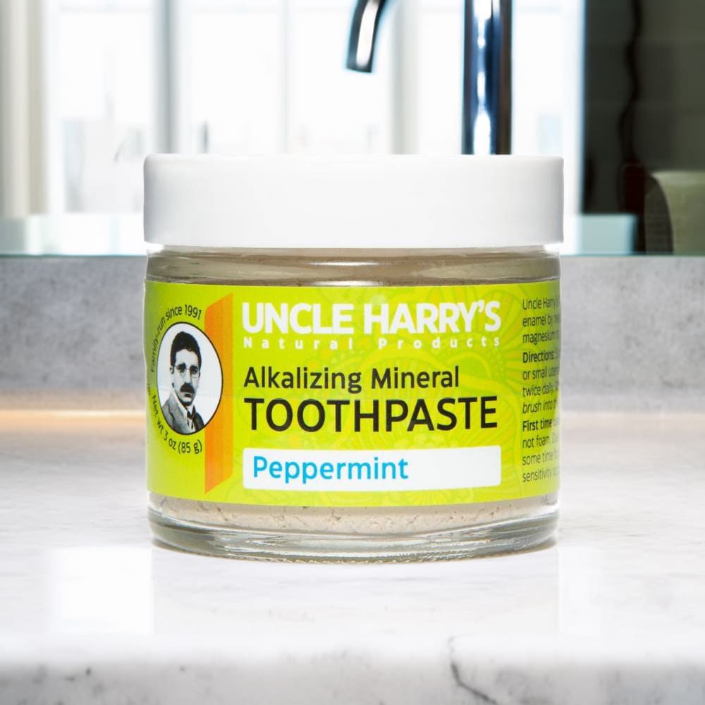 Small handcrafted glass jar of peppermint alkalizing mineral toothpaste in a clear container with white lid and bright yellow label, featured in Health & Wellness, Grooming and Personal Hygiene, USA Made, and Best Sellers collections.