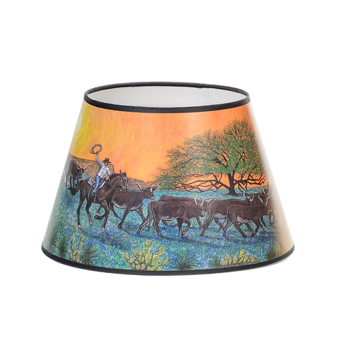 Parchment lamp shade featuring Southwestern artwork of a cowboy herding cattle at sunset, designed to soften lamp light, part of Lamps & Lighting and Best Sellers collections.