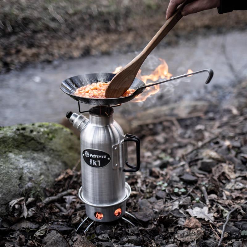 Compact outdoor cooking setup with a sturdy pan heating a meal over a portable stove in a natural forest setting, perfect for camping and Farm, Garden & Tool, Kitchen & Food collections.