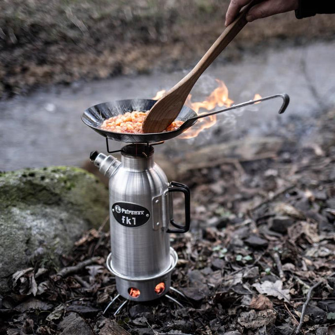 Compact outdoor cooking setup with a sturdy pan heating a meal over a portable stove in a natural forest setting, perfect for camping and Farm, Garden & Tool, Kitchen & Food collections.