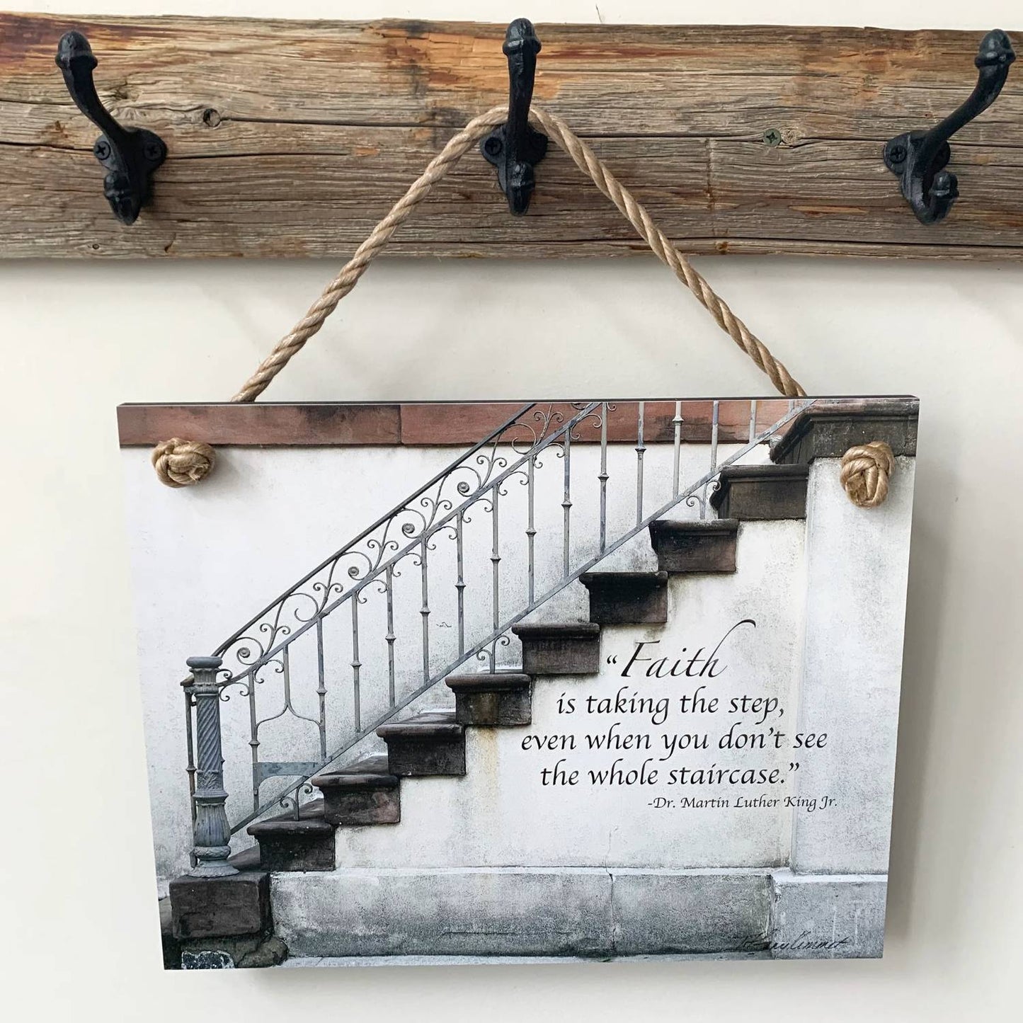 Rustic wall plaque featuring a stair design with an inspirational Bible verse, hanging by a natural rope on a wooden hook rack, part of USA Made Home & Decor collections.