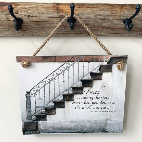 Rustic wall plaque featuring a stair design with an inspirational Bible verse, hanging by a natural rope on a wooden hook rack, part of USA Made Home & Decor collections.