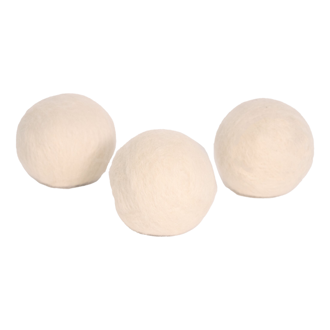 Set of three natural wool dryer balls in light cream color, handcrafted in the USA, designed for efficient, chemical-free drying in laundry supplies and home decor collections.