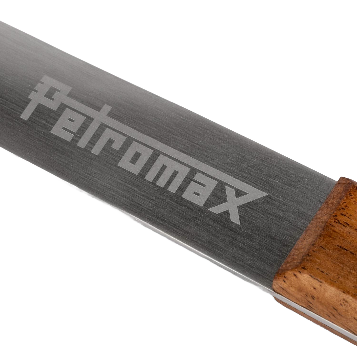 Close-up of a durable stainless steel serving spoon blade engraved with Petromax logo and attached to a hardwood walnut handle, handcrafted for Farm, Garden & Tool, Kitchen & Food, Camping, Storage and Serving, Best Sellers, and Promo Eligible collections.