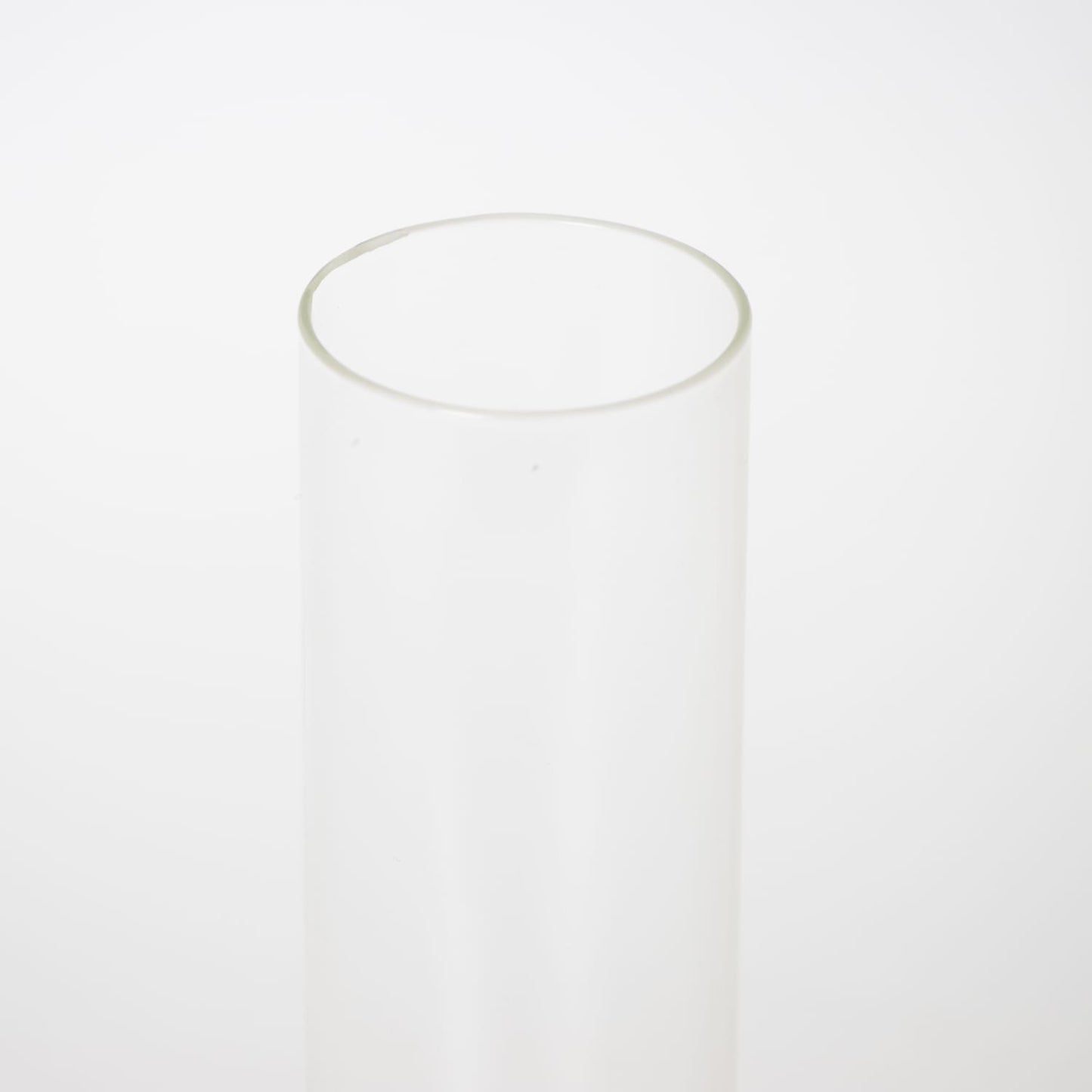 Clear glass oil lamp chimney with a 2-inch base, handcrafted for durability, suitable for lamps and featured in Lamps & Lighting, Parts and Accessories, and Chimneys and Globes collections.