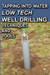 Close-up of a gray metal well drilling pipe with a rope handle inserted into the ground on a grassy surface, representing low tech well drilling methods featured in home and garden how-to books.