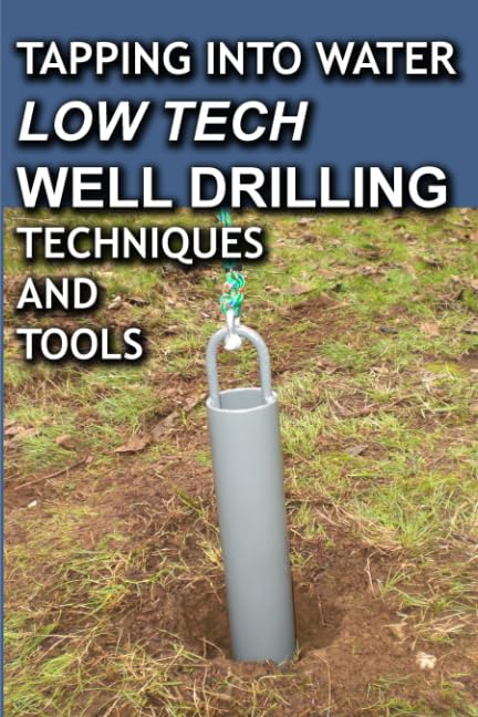 Close-up of a gray metal well drilling pipe with a rope handle inserted into the ground on a grassy surface, representing low tech well drilling methods featured in home and garden how-to books.
