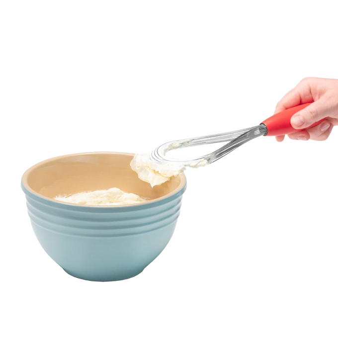 Hand holding a multi-use whisk with a red handle, lifting whipped cream from a blue mixing bowl, ideal for Kitchen & Food, Kitchen Gadgets, Cooking and Baking Helpers, Best Sellers, Promo Eligible collections.