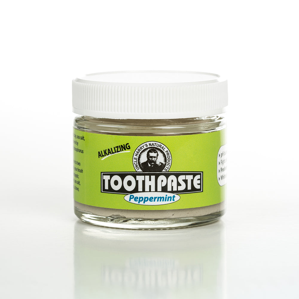 Small handcrafted glass jar of Uncle Harry's all-natural alkalizing peppermint toothpaste in a bright green label with white lid, featured in Health & Wellness, Grooming and Personal Hygiene, USA Made, Best Sellers, and Promo Eligible collections.
