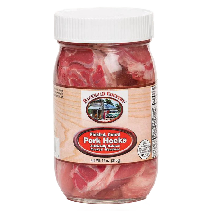 Glass jar of handcrafted pickled pork hocks, fully cooked and boneless, made in USA, featured in Kitchen & Food and Pantry collections with a distinctive home-style label.
