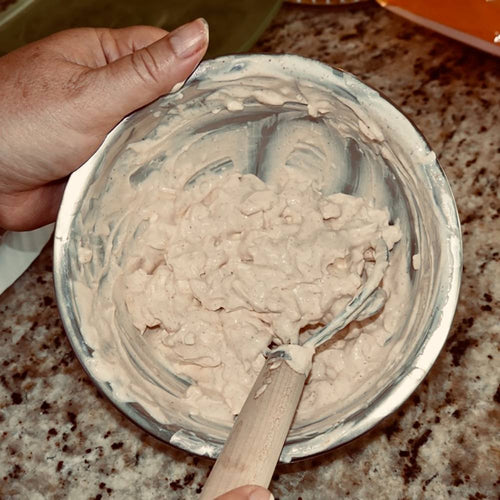 Handcrafted Amish made dough whisk with a natural wood handle and two spiral wires mixing sticky dough in a metal bowl, ideal for Kitchen & Food, Baking Supplies, and Amish Made collections.