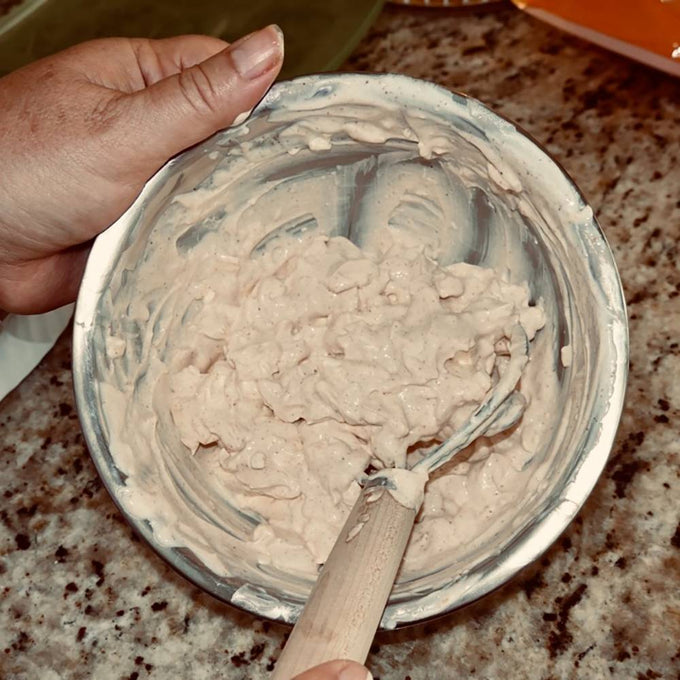 Handcrafted Amish made dough whisk with a natural wood handle and two spiral wires mixing sticky dough in a metal bowl, ideal for Kitchen & Food, Baking Supplies, and Amish Made collections.