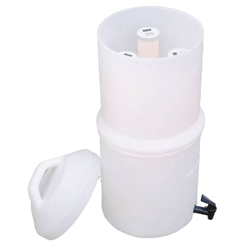 White plastic replacement filter housing with removable lid and central cylindrical element, designed for tabletop water filtration in emergency and appliance use.