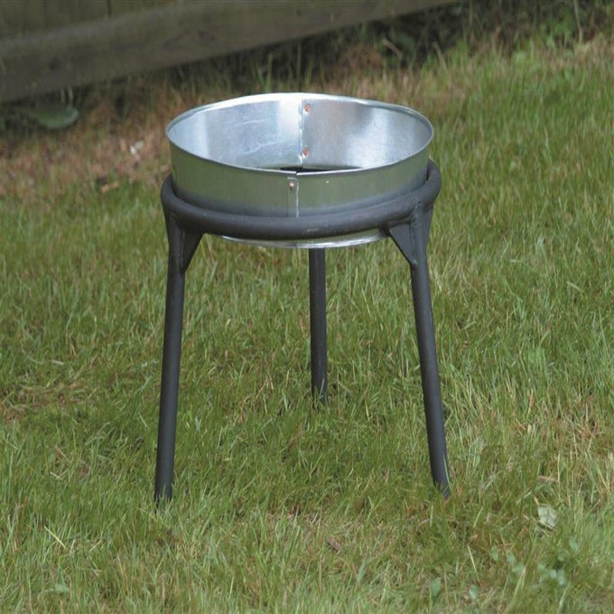 Sturdy three-legged iron stand with a round metal ring base, designed for supporting kettles or cookware in outdoor and camping settings, handcrafted in the USA.